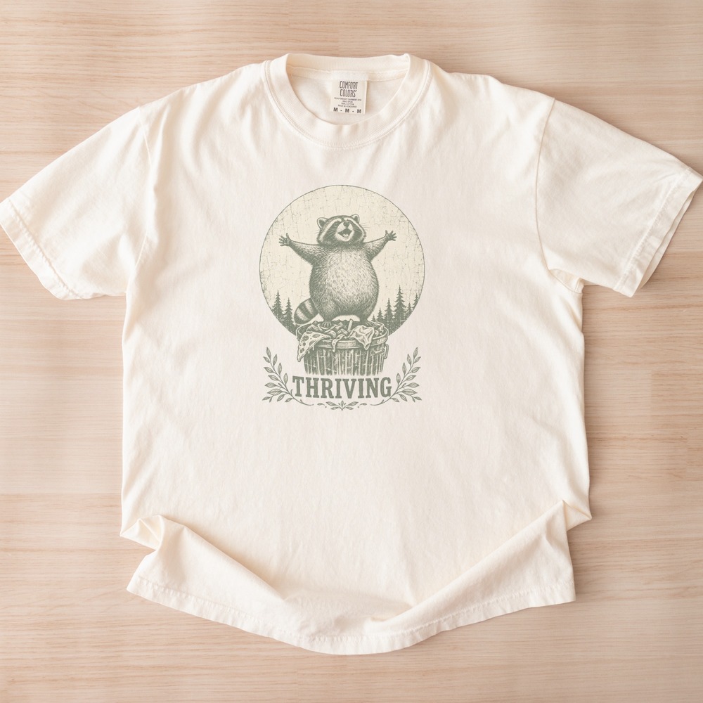 Thriving Raccoon Triumphant on Trash Can Badge Tee
